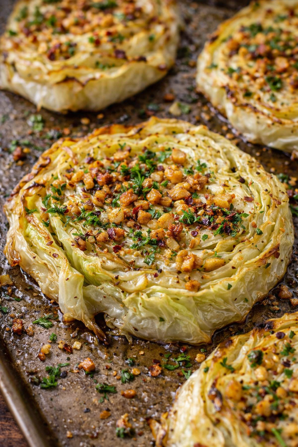 oven roasted garlic cabbage steaks on sheet pan